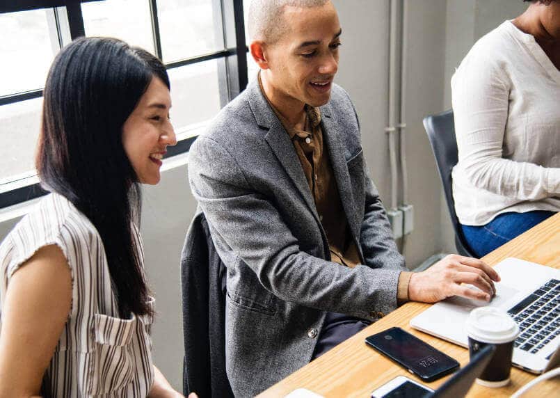 young-members-of-staff-using-a-laptop