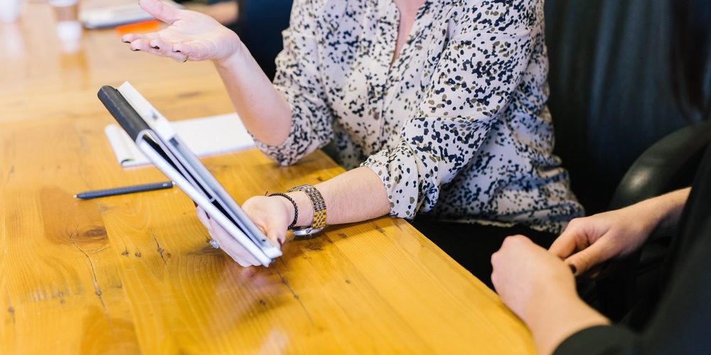 woman-discussing-dividends woman-discussing-dividends